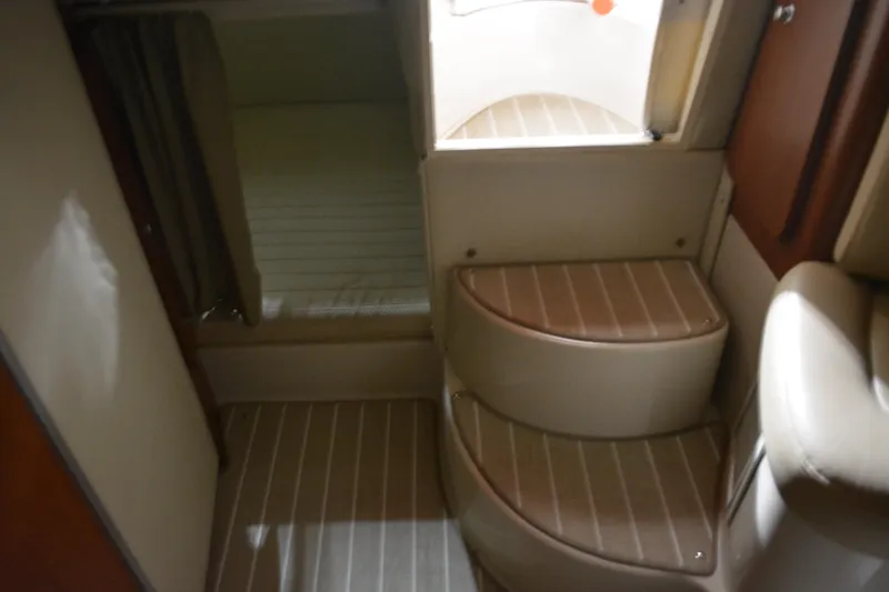 Slide: The Image of Interior of 2004 Chaparral Signature 290 boat, featuring steps and cabin area. - 28