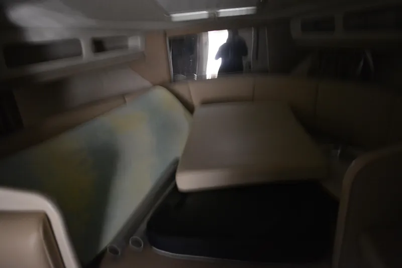 Slide: The Image of 2004 Chaparral Signature 290 interior cabin with seating and table. - 31