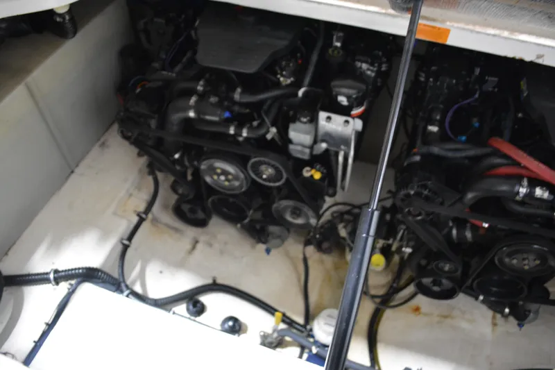 Slide: The Image of Engine compartment of 2004 Chaparral Signature 290 boat, showcasing dual engines. - 38