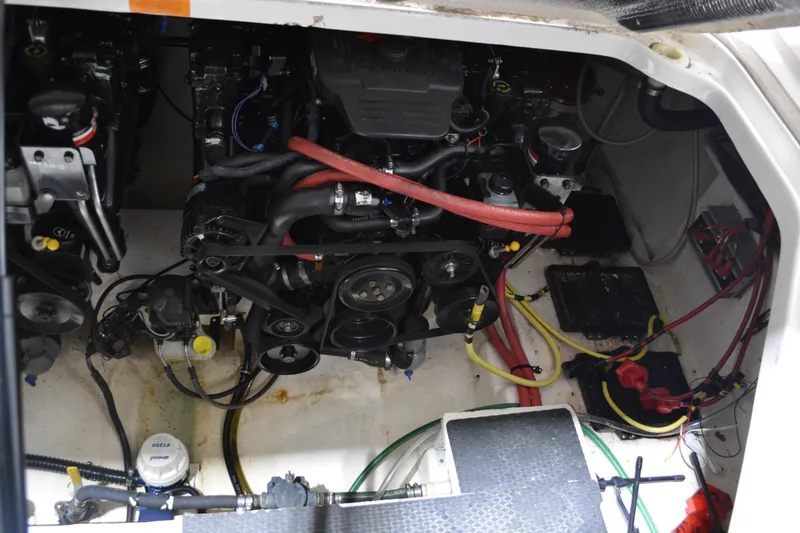 Slide: The Image of Engine compartment of a 2004 Chaparral Signature 290 boat, showing mechanical components. - 39