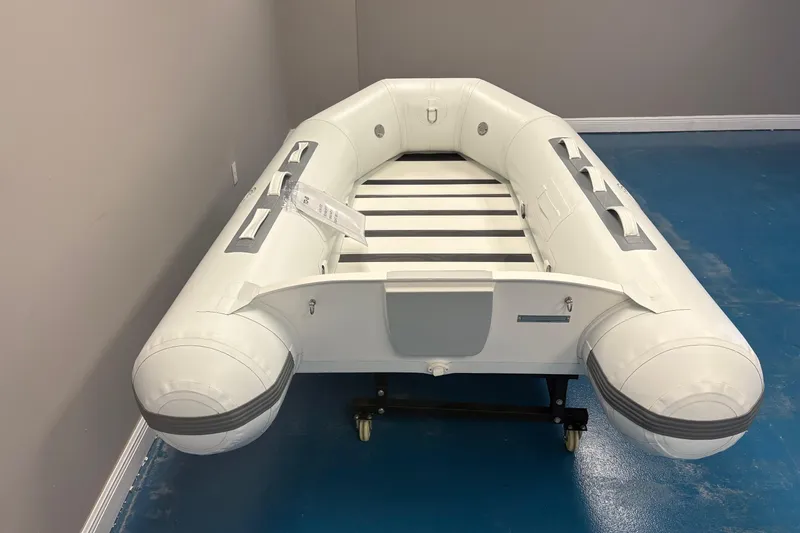 Slide: The Image of 2025 Flexboat TD-8 inflatable boat, white with gray accents, side view. - 6