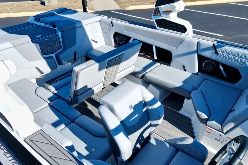 Slide: The Image of 2023 Nautique Super Air Nautique GS22 interior with luxurious seating and modern design. - 12