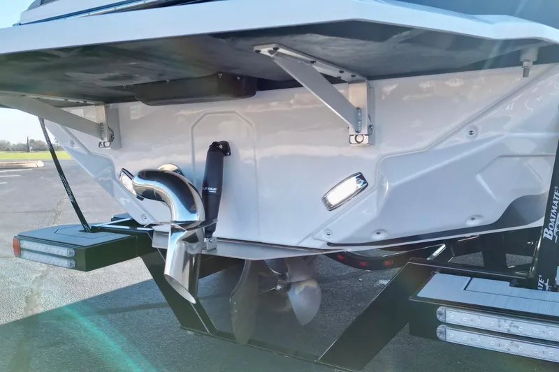 Slide: The Image of 2023 Nautique Super Air Nautique GS22 boat stern with propeller and exhaust system. - 17