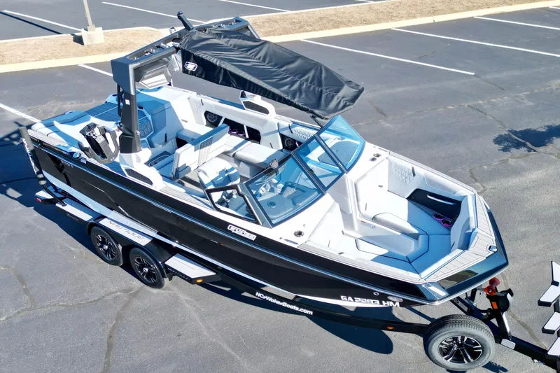 Slide: The Image of 2023 Nautique Super Air Nautique GS22 boat on trailer in parking lot. - 5