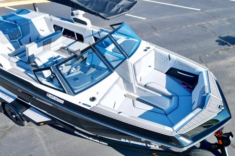 Slide: The Image of 2023 Nautique Super Air Nautique GS22 boat, aerial view, sleek design, spacious seating. - 8