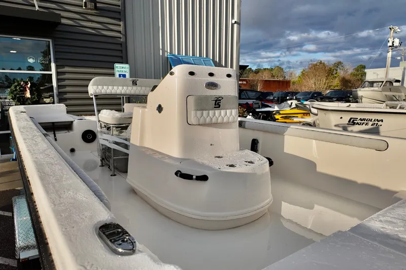 Slide: The Image of 2026 Carolina Skiff 21 LS boat displayed outdoors, showcasing its sleek design and spacious interior. - 3