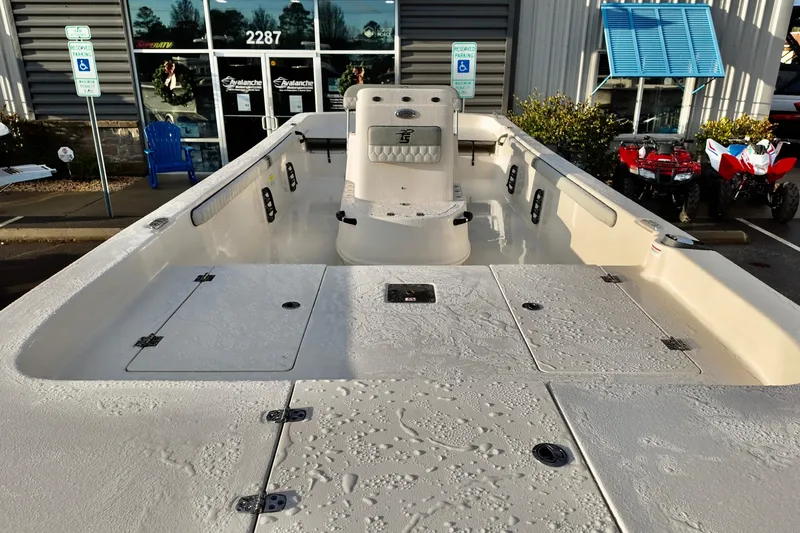 Slide: The Image of 2026 Carolina Skiff 21 LS boat interior, showcasing spacious deck and seating at dealership. - 4