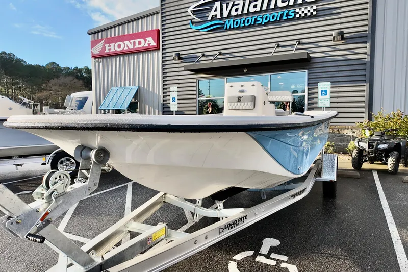 Slide: The Image of 2026 Carolina Skiff 21 LS boat on trailer at Avalanche Motorsports dealership. - 9