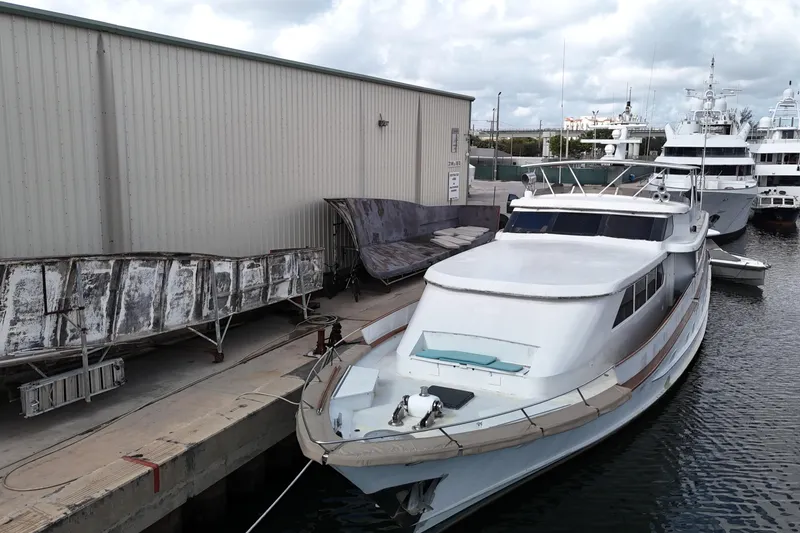 Slide: The Image of 1990 Denison Pilothouse Cockpit Motoryacht docked at marina, overcast sky. - 10
