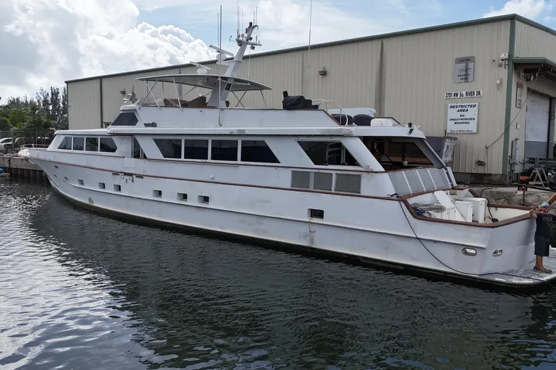 Slide: The Image of 1990 Denison Pilothouse Cockpit Motoryacht docked at marina, side view. - 14
