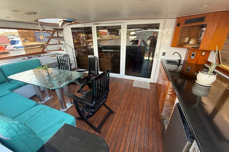 Slide: The Image of Luxurious 1990 Denison Pilothouse Cockpit Motoryacht interior with elegant seating and kitchenette. - 35