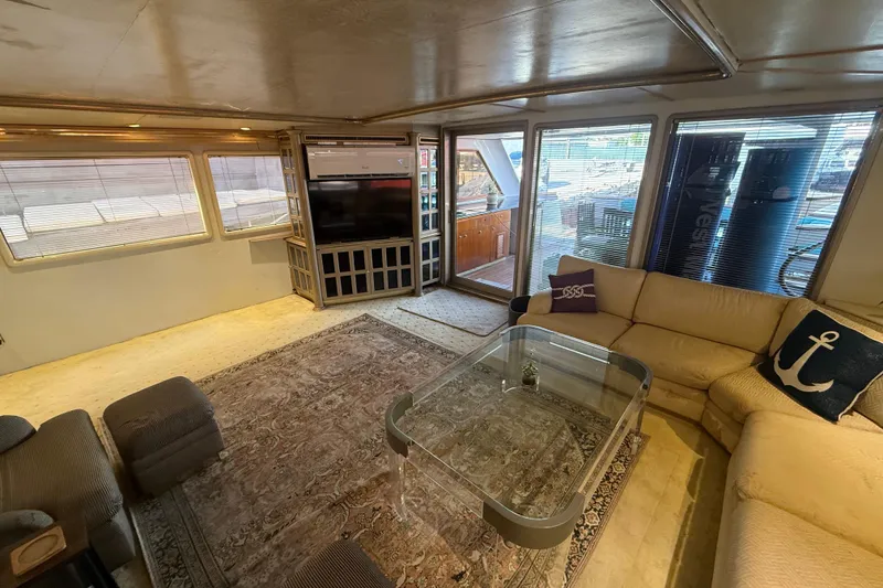 Slide: The Image of Luxurious interior of 1990 Denison Pilothouse Cockpit Motoryacht with plush seating and elegant decor. - 39