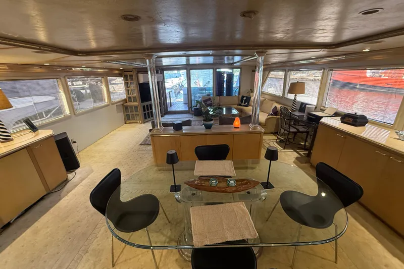 Slide: The Image of Luxurious interior of 1990 Denison Pilothouse Cockpit Motoryacht with modern furnishings and large windows. - 43