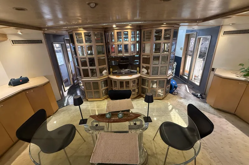 Slide: The Image of Luxurious interior of a 1990 Denison Pilothouse Cockpit Motoryacht with elegant furnishings. - 44