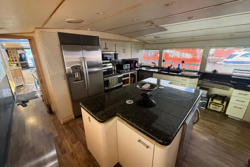 Slide: The Image of Luxurious kitchen interior of 1990 Denison Pilothouse Cockpit Motoryacht with modern appliances. - 60