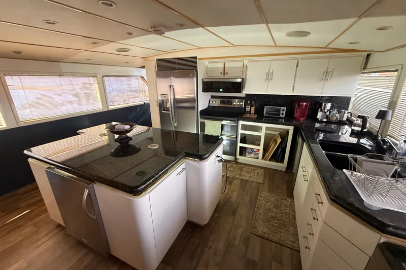 Slide: The Image of Luxurious kitchen in 1990 Denison Pilothouse Cockpit Motoryacht with modern appliances and sleek design. - 61