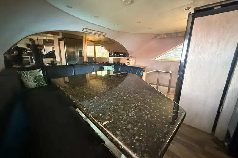 Slide: The Image of Luxurious interior of 1990 Denison Pilothouse Cockpit Motoryacht with sleek dining area. - 63