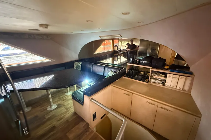 Slide: The Image of Interior of 1990 Denison Pilothouse Cockpit Motoryacht with seating and storage. - 65