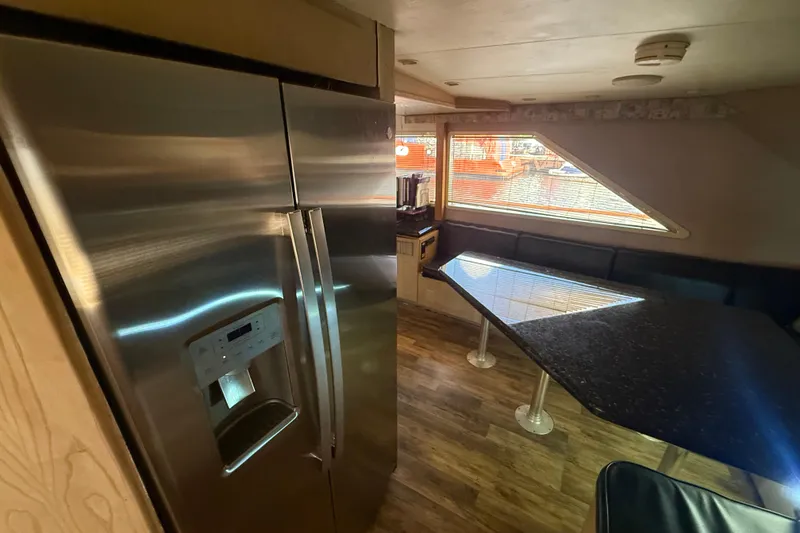 Slide: The Image of Interior of 1990 Denison Pilothouse Cockpit Motoryacht with modern kitchen and dining area. - 66