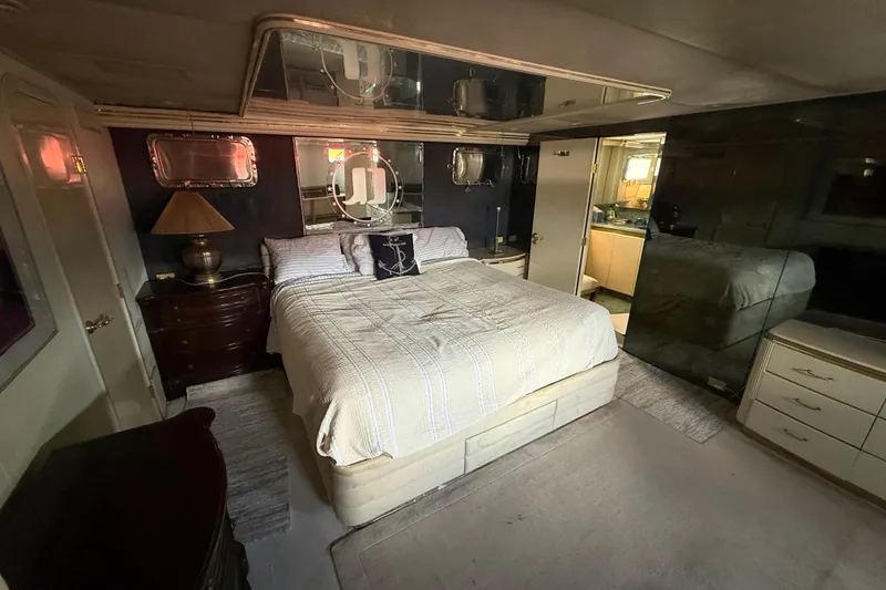 Slide: The Image of Luxurious bedroom interior of 1990 Denison Pilothouse Cockpit Motoryacht with elegant furnishings. - 67