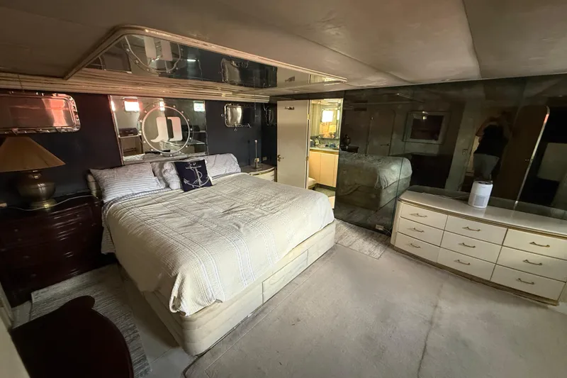 Slide: The Image of Luxurious bedroom in a 1990 Denison Pilothouse Cockpit Motoryacht, featuring elegant decor. - 68
