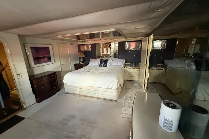 Slide: The Image of Luxurious bedroom in a 1990 Denison Pilothouse Cockpit Motoryacht, featuring elegant decor and ample space. - 70