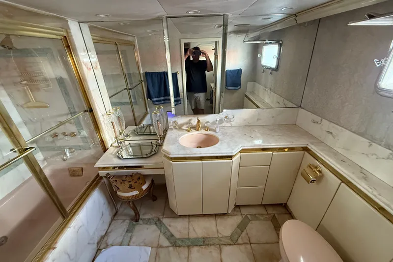 Slide: The Image of Luxurious bathroom in 1990 Denison Pilothouse Cockpit Motoryacht with marble and gold accents. - 71