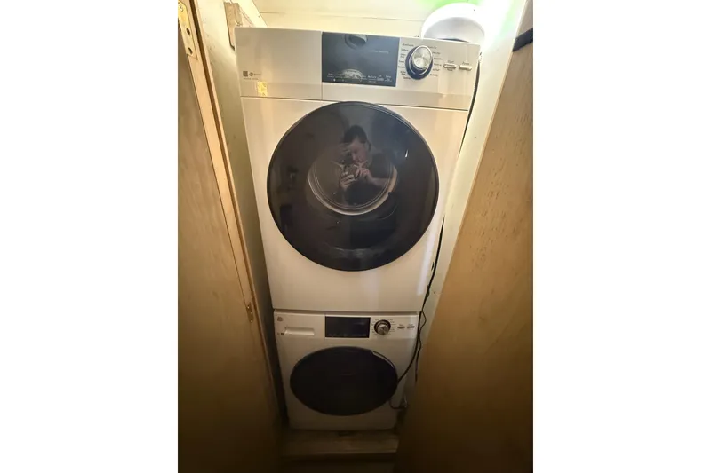 Slide: The Image of Stacked washer and dryer inside 1990 Denison Pilothouse Cockpit Motoryacht. - 82