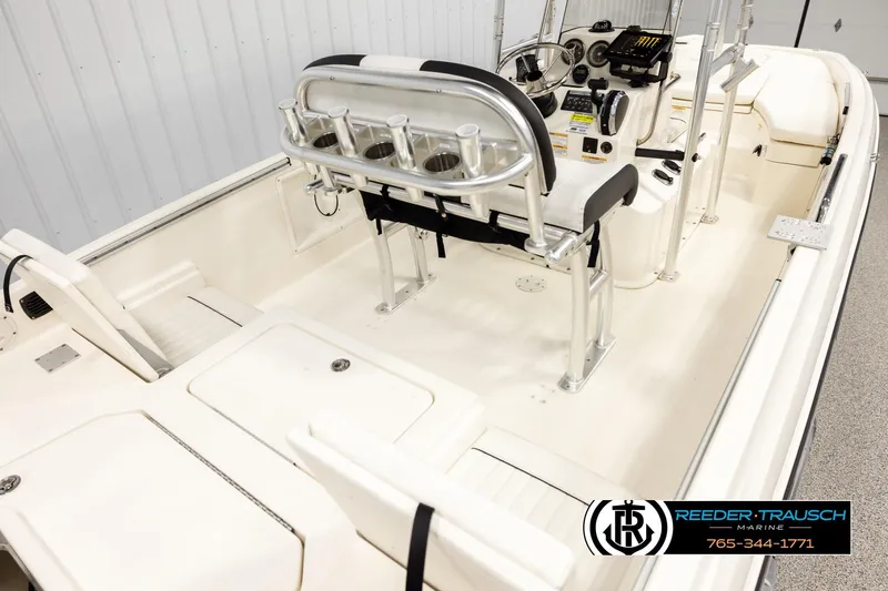 Slide: The Image of 2017 Bayliner Element F21 boat interior with seating and control console. - 10