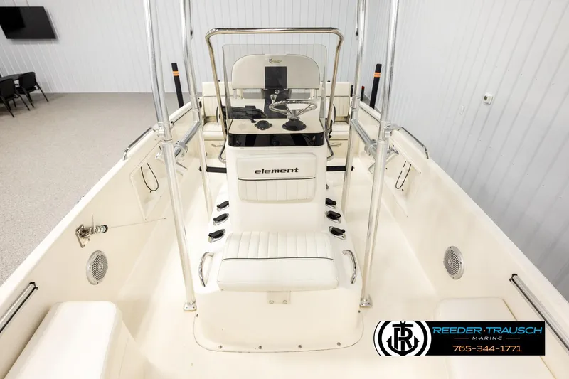 Slide: The Image of 2017 Bayliner Element F21 boat interior with steering console and seating. - 15