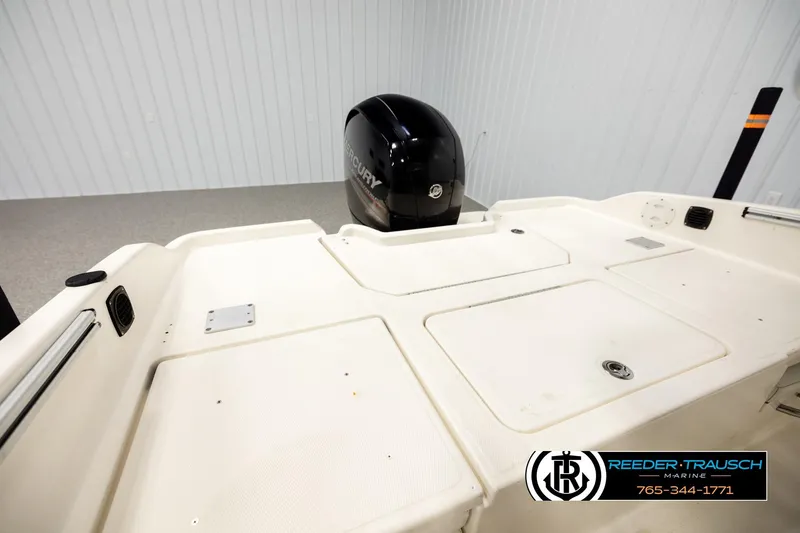 Slide: The Image of 2017 Bayliner Element F21 boat deck with Mercury engine in showroom. - 20