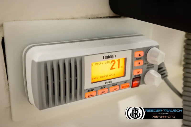 Slide: The Image of Uniden marine radio on 2017 Bayliner Element F21 boat dashboard. - 28