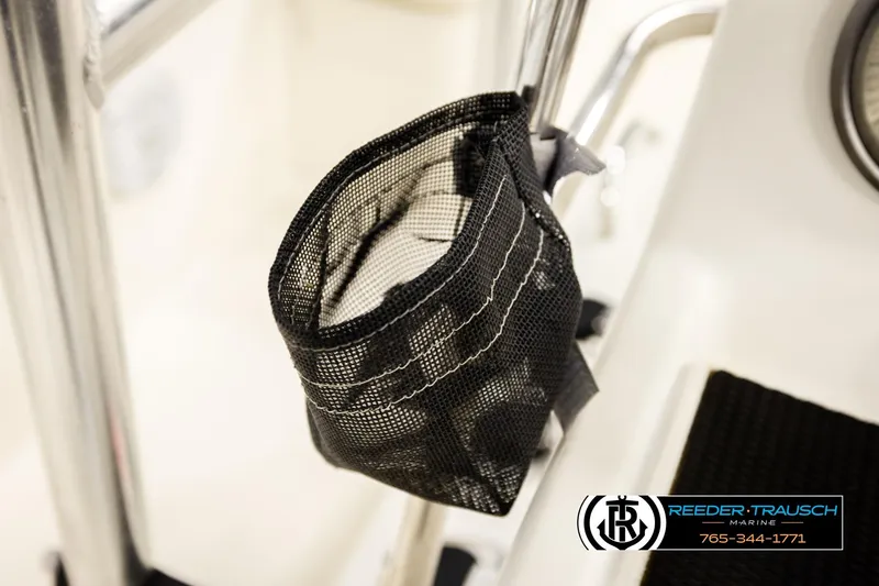 Slide: The Image of Mesh storage bag on 2017 Bayliner Element F21 boat, Reeder-Trausch Marine logo visible. - 30