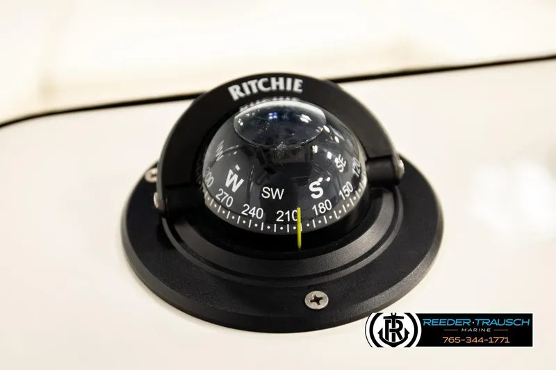 Slide: The Image of Ritchie compass on 2017 Bayliner Element F21 boat dashboard. - 32