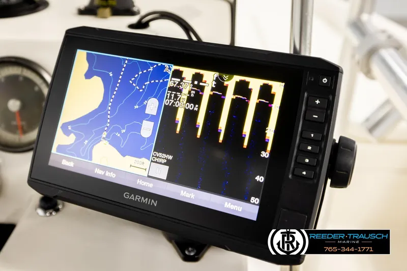 Slide: The Image of Garmin navigation system on 2017 Bayliner Element F21 boat dashboard, Reeder-Trausch Marine branding. - 34