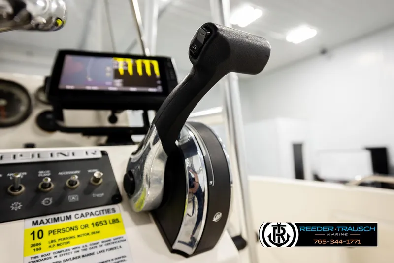 Slide: The Image of 2017 Bayliner Element F21 boat controls with capacity label and navigation screen. - 36