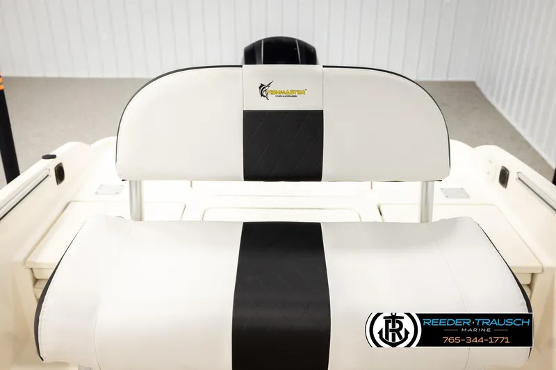 Slide: The Image of 2017 Bayliner Element F21 boat seat with white and black upholstery. - 37