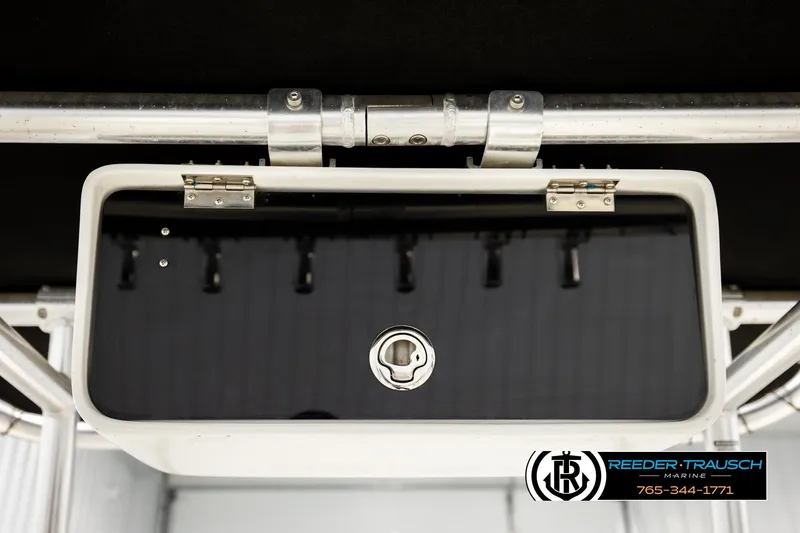 Slide: The Image of 2017 Bayliner Element F21 storage compartment with lock, featuring Reeder-Trausch Marine branding. - 39