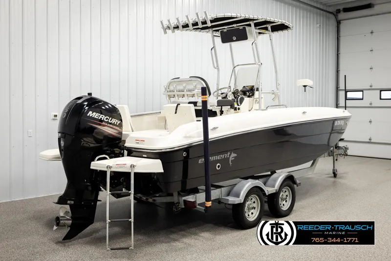 Slide: The Image of 2017 Bayliner Element F21 boat with Mercury engine on trailer in indoor storage. - 4