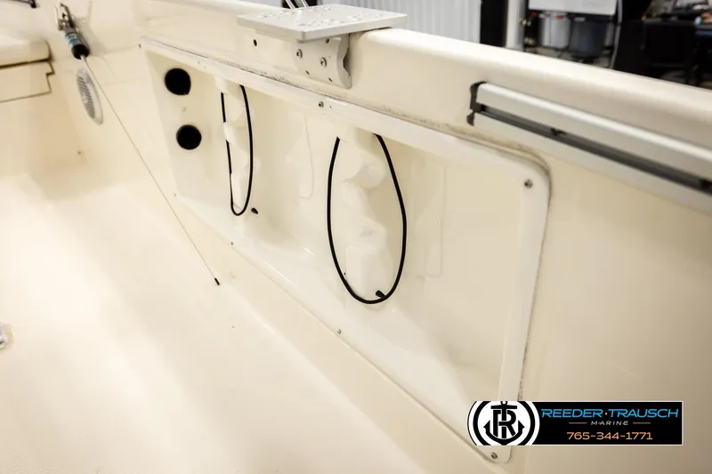 Slide: The Image of 2017 Bayliner Element F21 boat interior with storage compartments and marine equipment. - 43