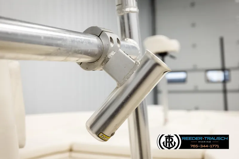 Slide: The Image of Close-up of a 2017 Bayliner Element F21 boat's metal rod holder. - 44