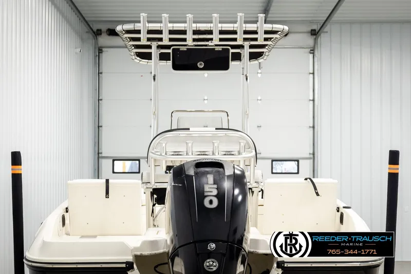 Slide: The Image of 2017 Bayliner Element F21 boat with 150 HP engine in storage facility. - 5