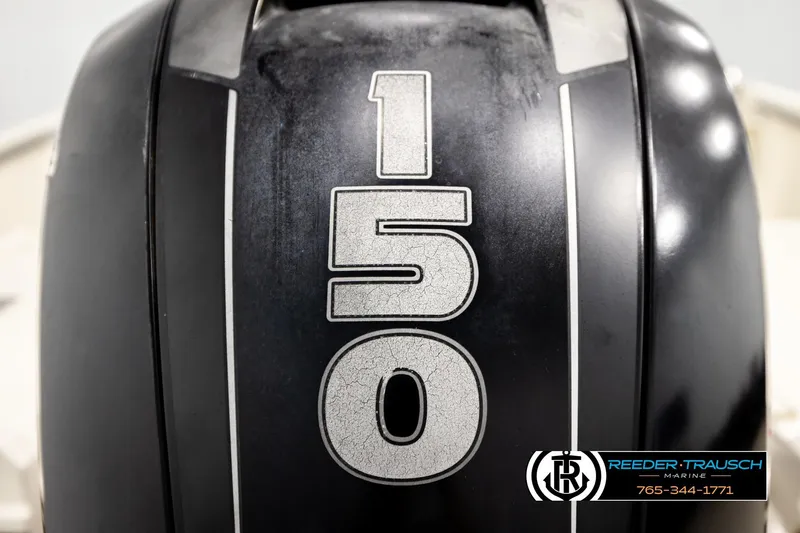 Slide: The Image of Close-up of 2017 Bayliner Element F21 outboard motor with '150' marking. - 52