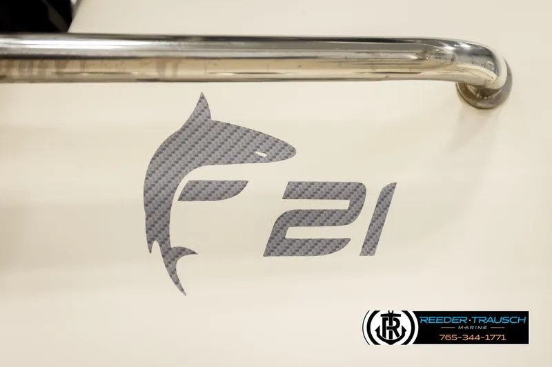 Slide: The Image of 2017 Bayliner Element F21 logo with shark design and Reeder-Trausch Marine branding. - 55