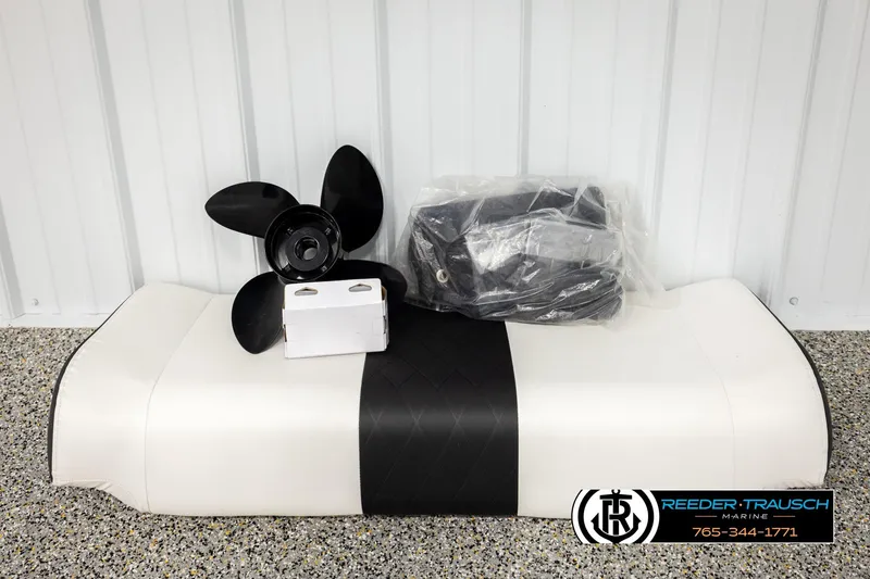 Slide: The Image of 2017 Bayliner Element F21 boat accessories: propeller, seat cushion, and cover. - 56
