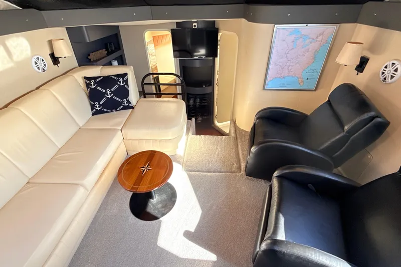Slide: The Image of Luxurious interior of 1998 Mainship 47 Motor Yacht with leather seating and nautical decor. - 40