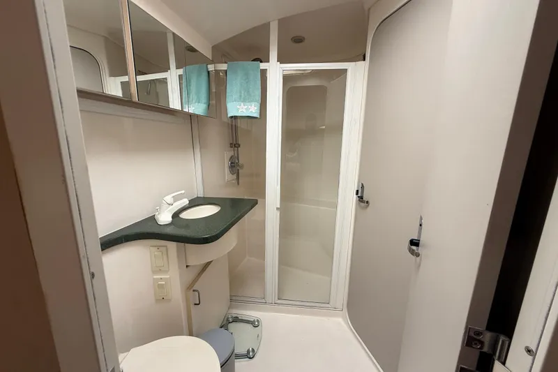 Slide: The Image of Bathroom interior of 1998 Mainship 47 Motor Yacht with shower and sink. - 51