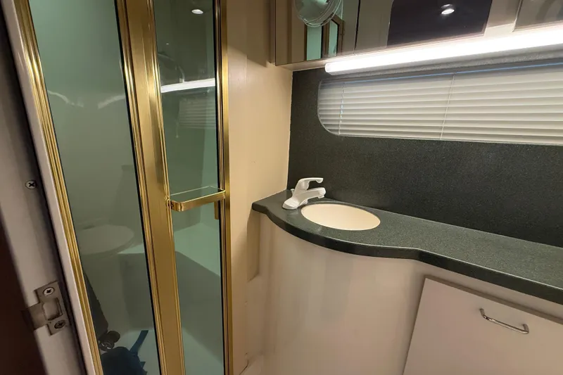 Slide: The Image of Bathroom interior of 1998 Mainship 47 Motor Yacht with shower and sink. - 52