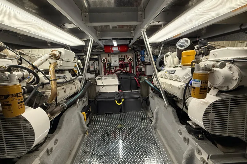 Slide: The Image of Engine room of a 1998 Mainship 47 Motor Yacht with Caterpillar engines. - 64