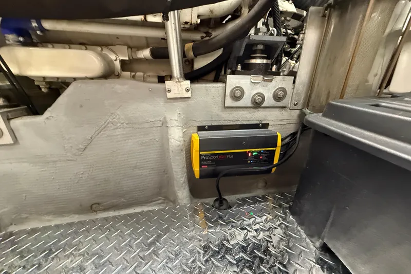 Slide: The Image of Engine room of 1998 Mainship 47 Motor Yacht with ProSportHD Plus charger. - 69